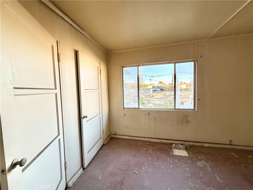 13807 Carson Street Trona, CA 93562 - Photo 16 of 37 a view of an empty room with a window