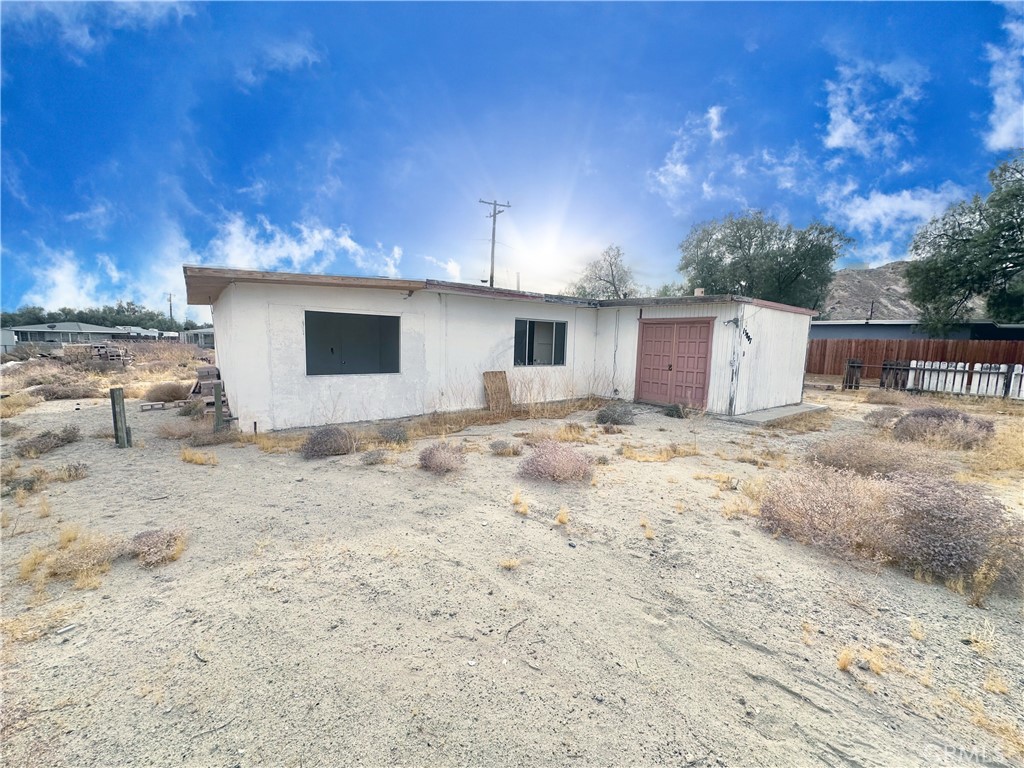13807 Carson Street Trona, CA 93562 - Photo 37 of 37 a view of a white house with a yard