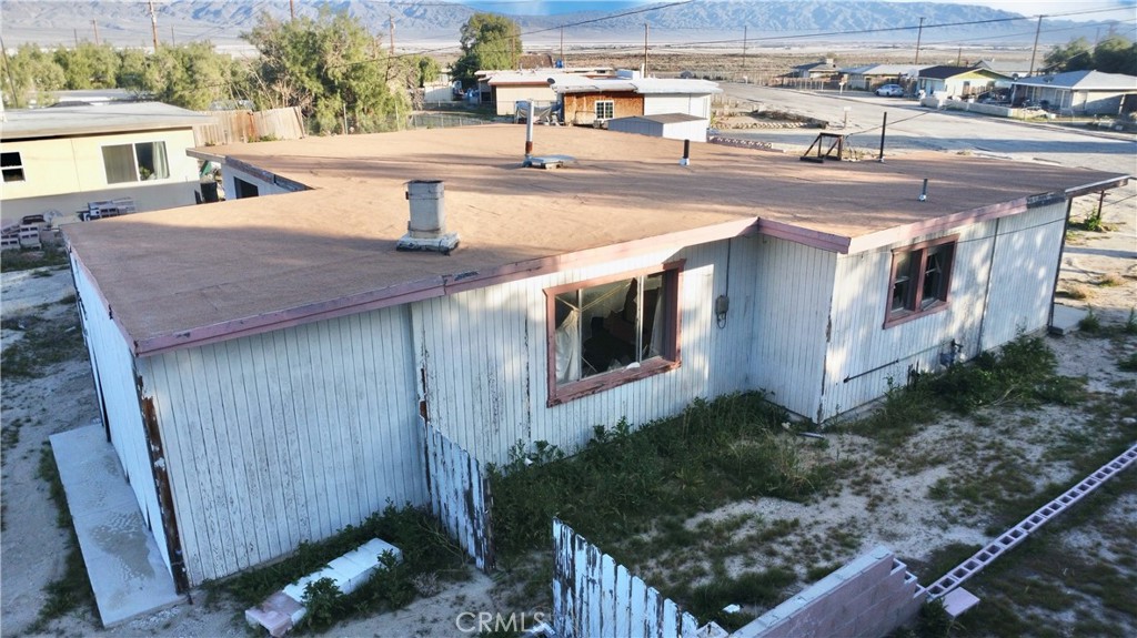 13807 Carson Street Trona, CA 93562 - Photo 6 of 37 a view of a house with backyard and sitting area