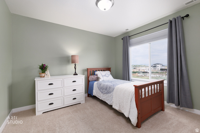 1654 South 730 West Provo, UT 84601 - Photo 17 of 33 Spacious room featuring neutral wall paint, light-colored carpet flooring, and a large window with privacy blinds