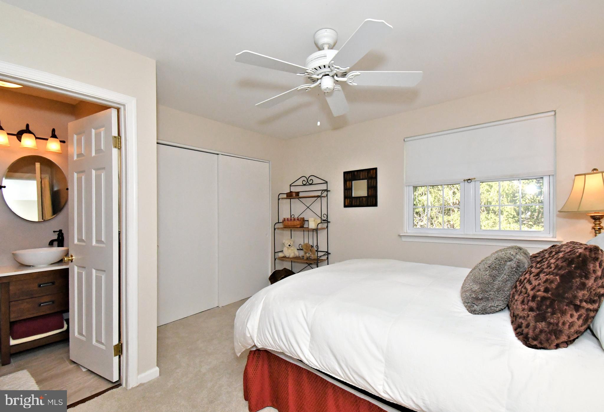 1903 Red Maple Grove Ambler, PA 19002 - Photo 20 of 32 a bedroom with a bed and a chandelier