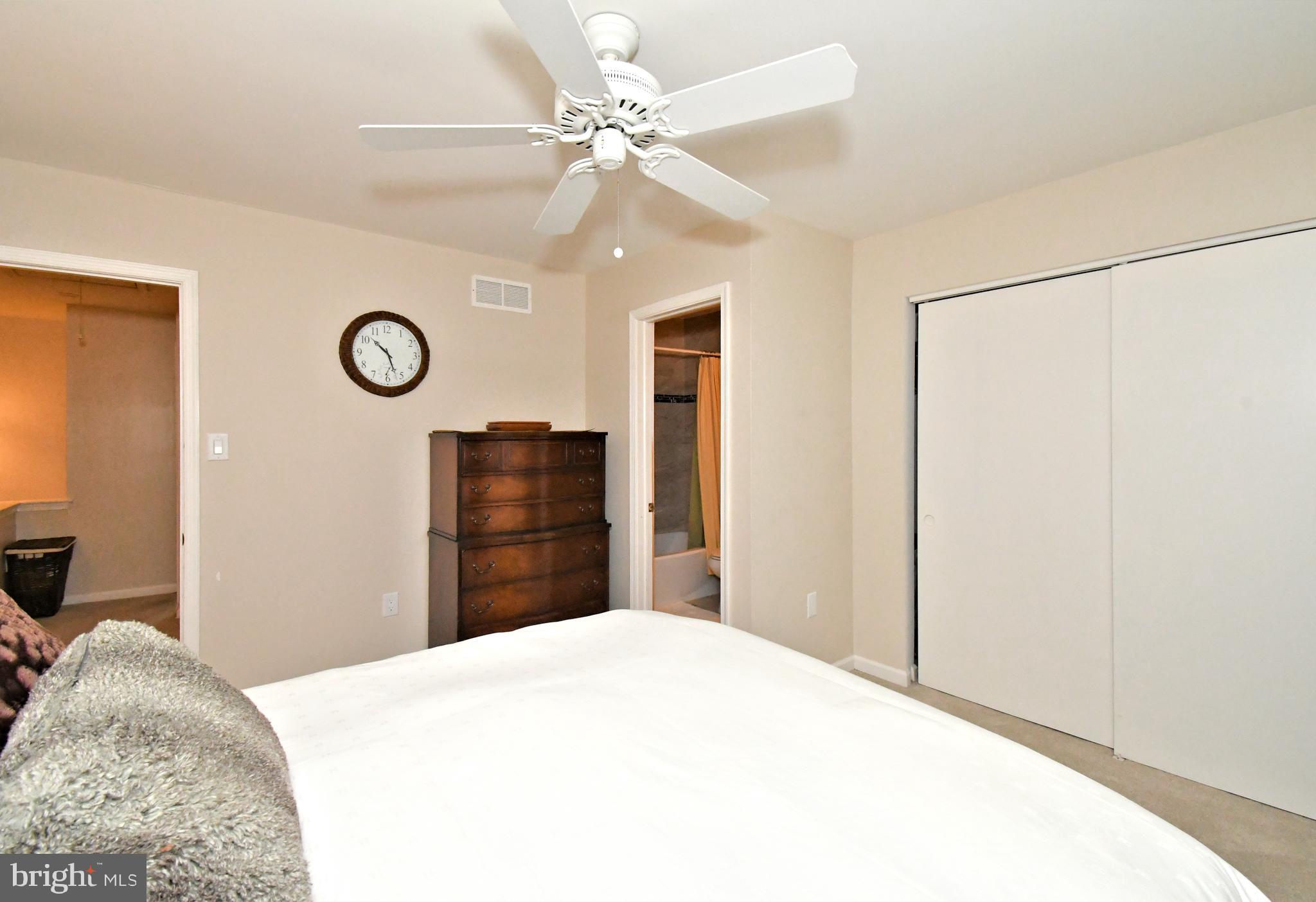 1903 Red Maple Grove Ambler, PA 19002 - Photo 23 of 32 a bedroom with a bed and a chandelier