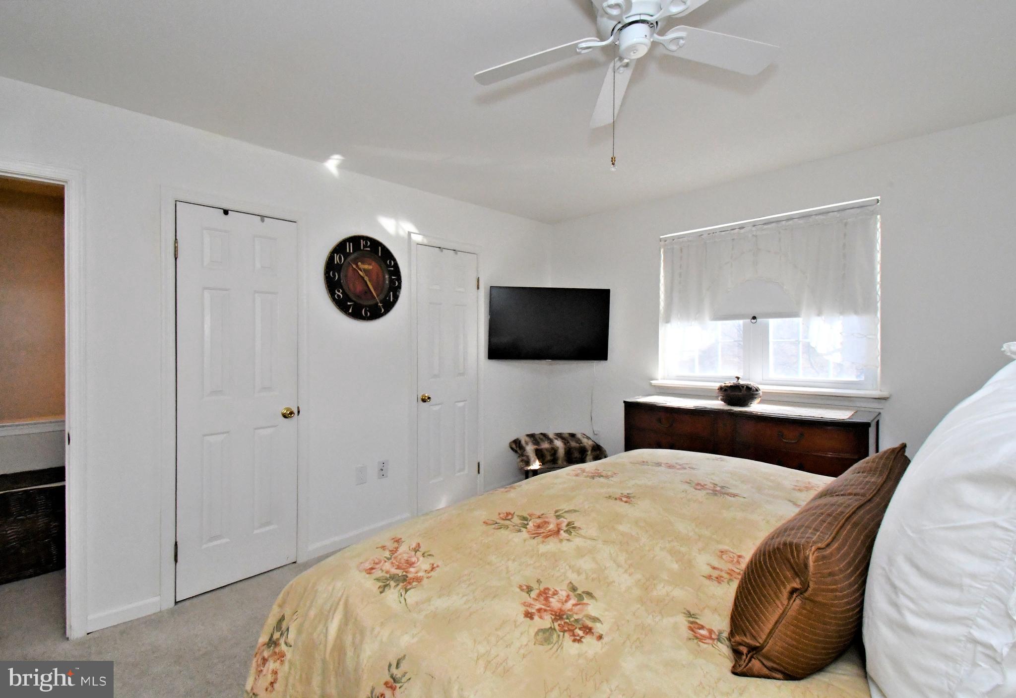 1903 Red Maple Grove Ambler, PA 19002 - Photo 26 of 32 a bedroom with a bed and a flat tv screen on the dresser