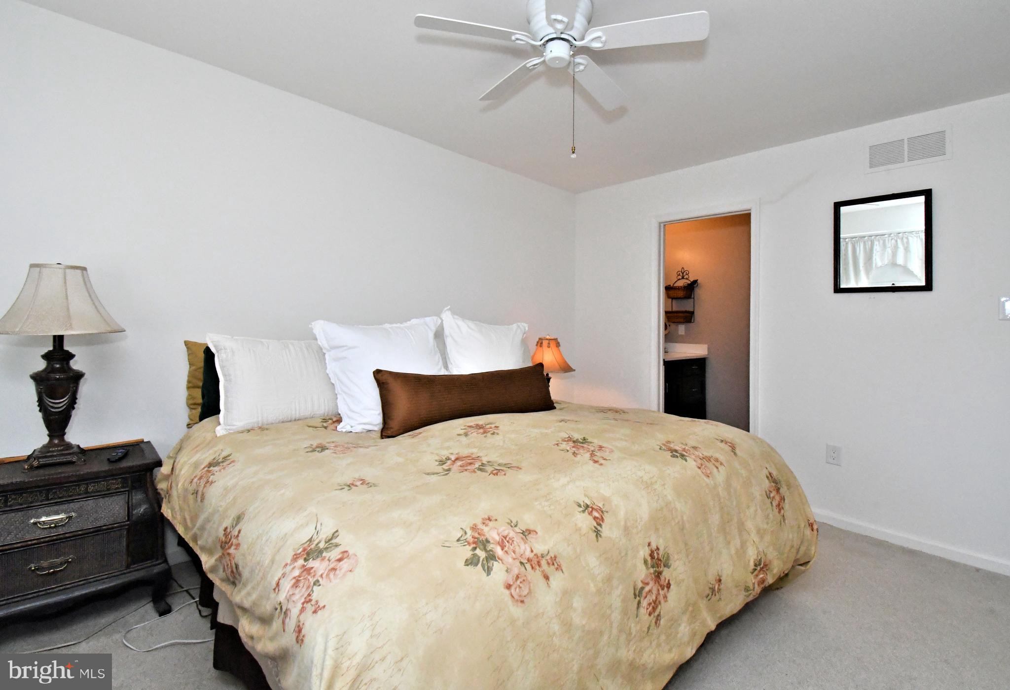 1903 Red Maple Grove Ambler, PA 19002 - Photo 27 of 32 a bedroom with a bed and a chandelier