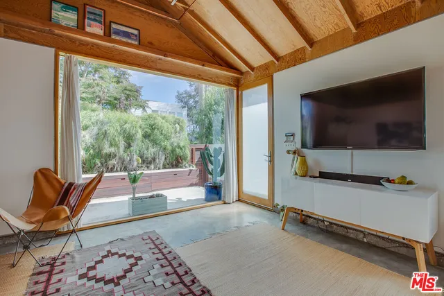 a room with furniture and a flat screen tv