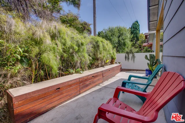a view of a bench in front of building
