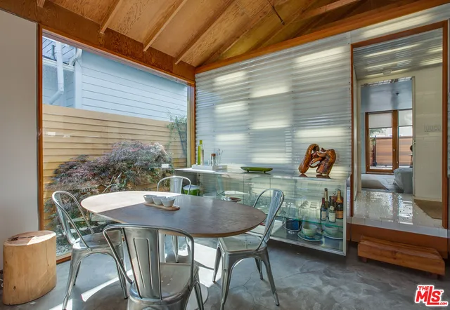 a view of a house with a backyard space and balcony