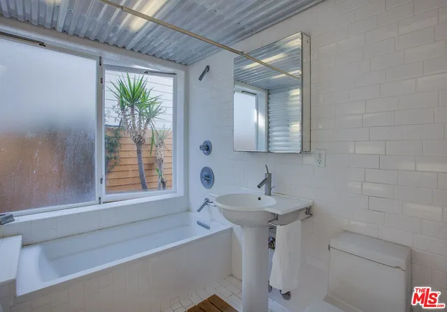 a bathroom with a sink and a bathtub
