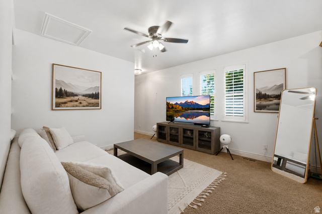 7772 South Rustic Cove Midvale, UT 84047 - Photo 7 of 39 Bright, open living room featuring neutral wall finishes, ceiling fan with integrated lighting, and wood-finish flooring throughout