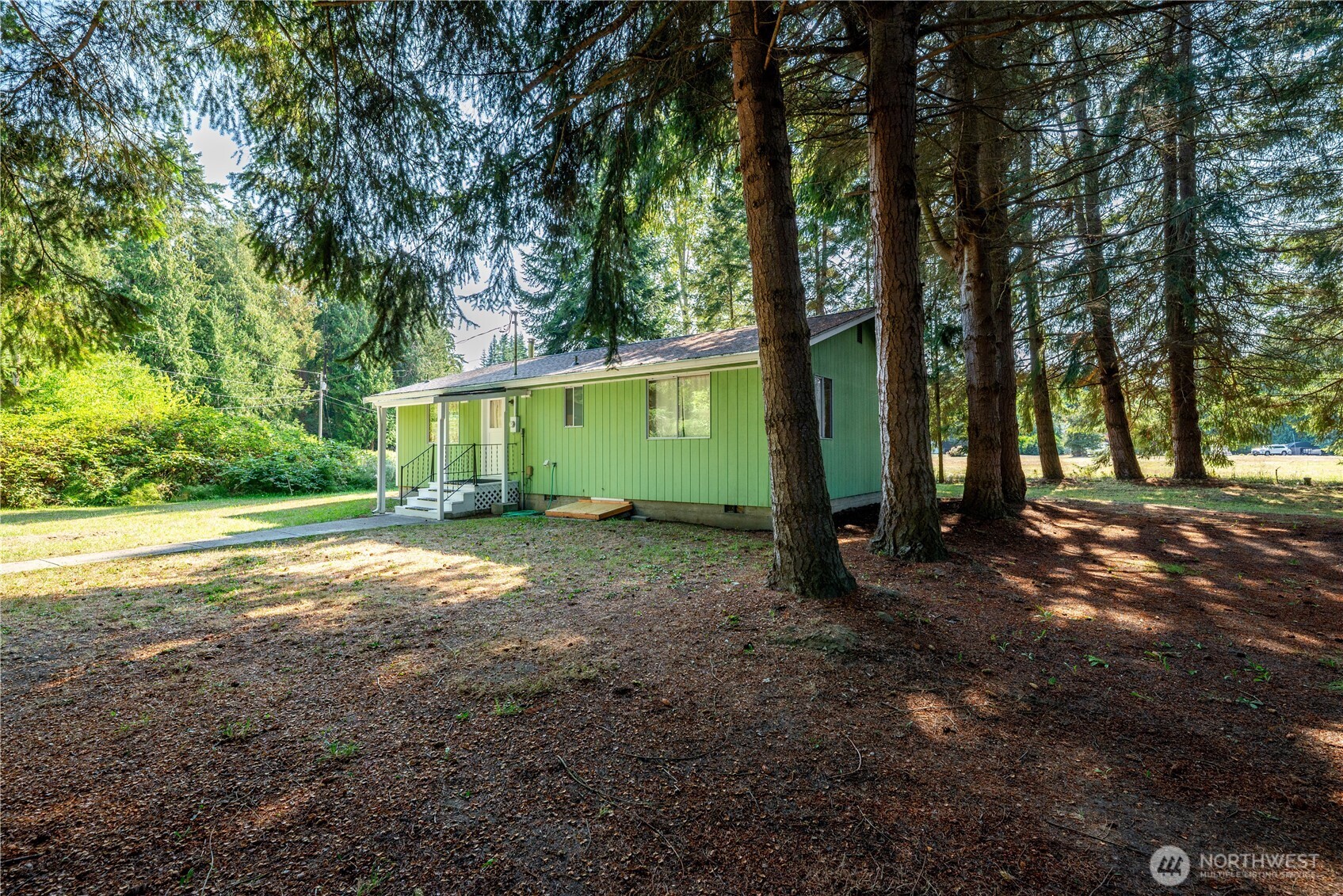456 Fasola Road Sequim, WA 98382 - Photo 33 of 34 a view of a house with backyard and trees