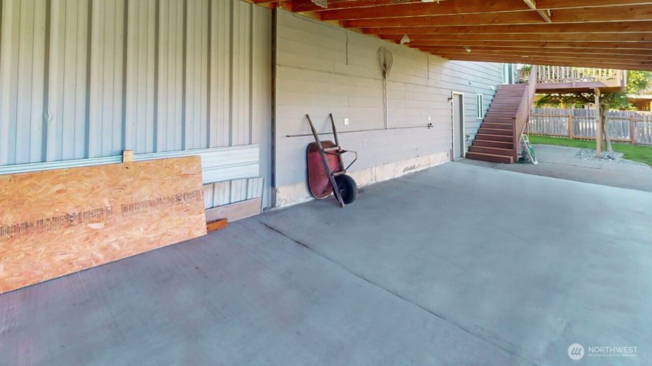 14835 Valley View Drive Mount Vernon, WA 98273 - Photo 19 of 25 a view of a room with wooden walls and stairs