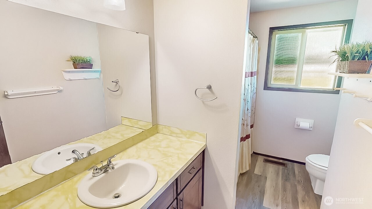 14835 Valley View Drive Mount Vernon, WA 98273 - Photo 9 of 25 a bathroom with a granite countertop sink toilet and shower