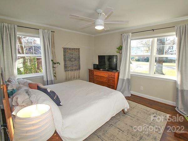 4327 Applegate Road Charlotte, NC 28209 - Photo 18 of 29 a bedroom with a bed and a flat screen tv