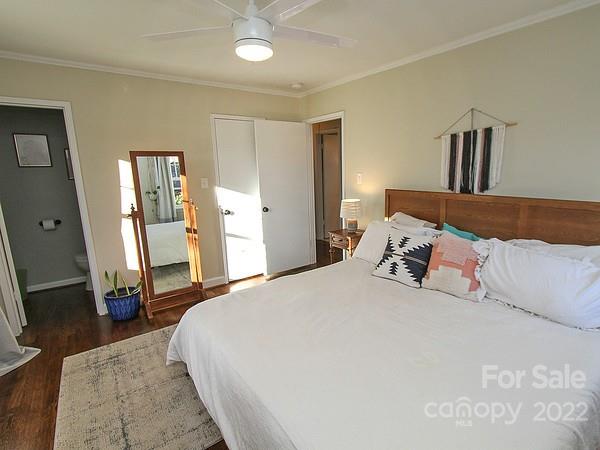 4327 Applegate Road Charlotte, NC 28209 - Photo 20 of 29 a bedroom with a bed and a mirror