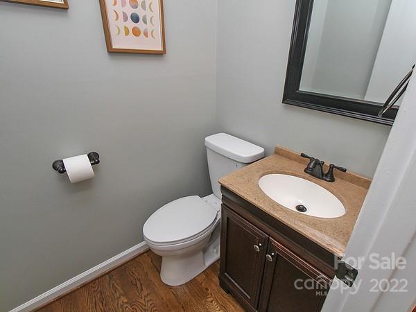 4327 Applegate Road Charlotte, NC 28209 - Photo 21 of 29 a bathroom with a toilet a sink and mirror