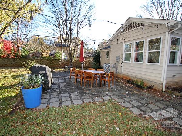 4327 Applegate Road Charlotte, NC 28209 - Photo 22 of 29 a wooden bench sitting in front of a house