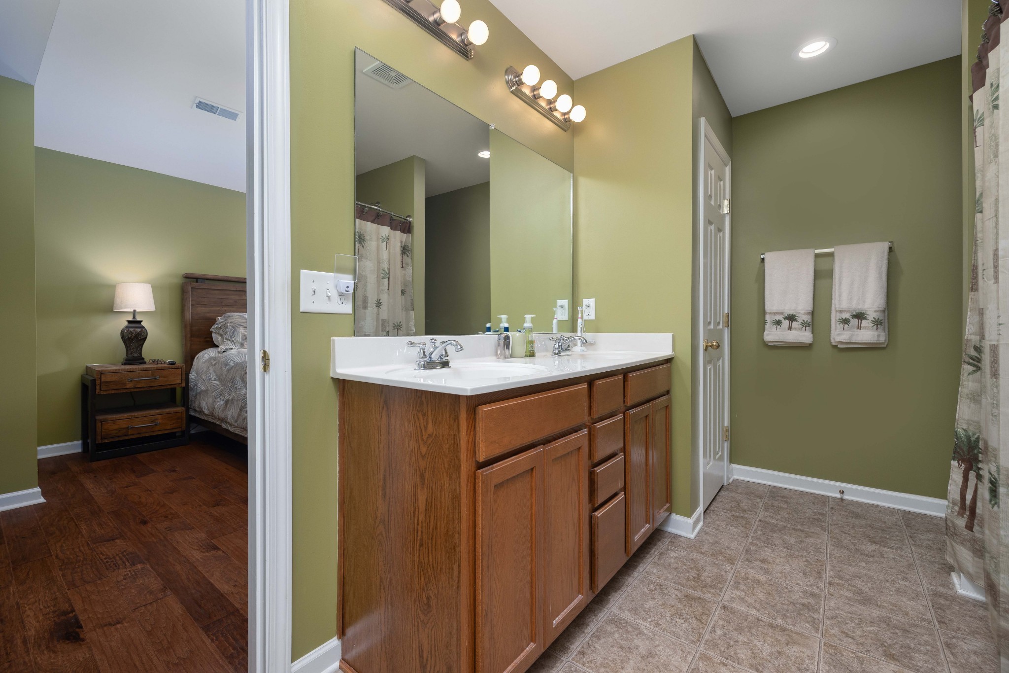 2736 McLemore Road Franklin, TN 37064 - Photo 17 of 50 a en suite bathroom with a sink a mirror and a shower