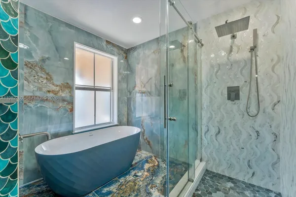 a view of a house with backyard and porch