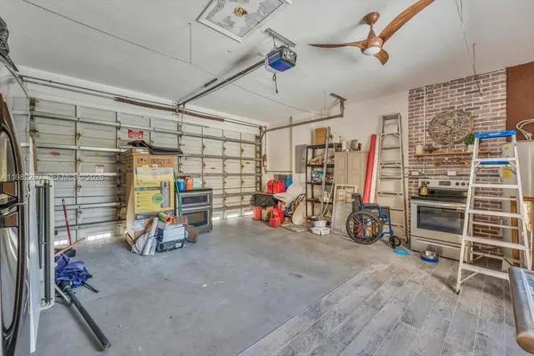 an aerial view of a house with a yard and potted plants