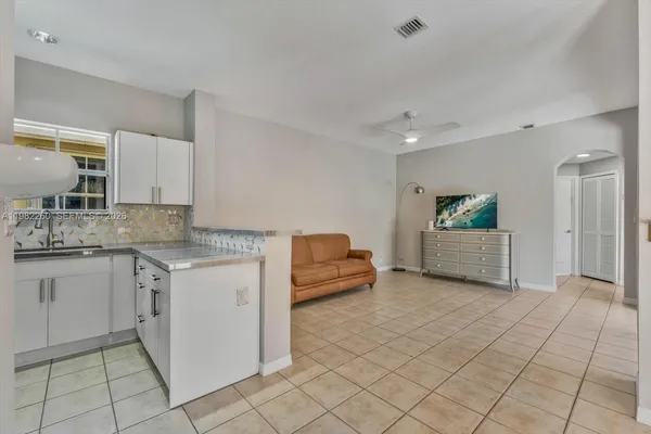 a kitchen with a sink and cabinets