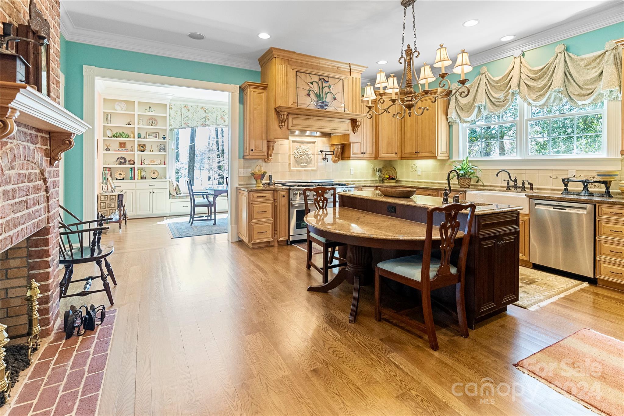 229 Joseph Kershaw Road Eastover, SC 29044 - Photo 30 of 48 a view of a dining room with furniture a chandelier and wooden floor