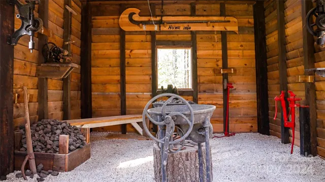 a living room with furniture a window and a chandelier