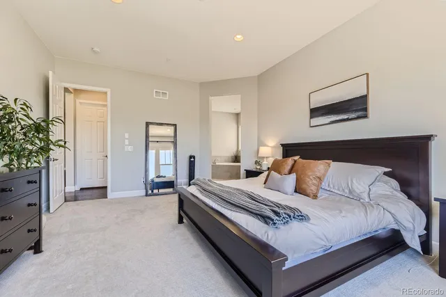 a bed room with a bed and a couch