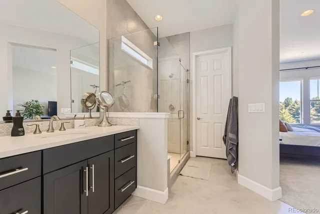 a bathroom with a double vanity sink a and a mirror