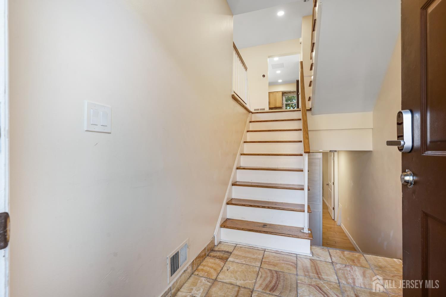 6304 Hana Road Edison, NJ 08817 - Photo 13 of 21 a view of entryway and hall with wooden floor