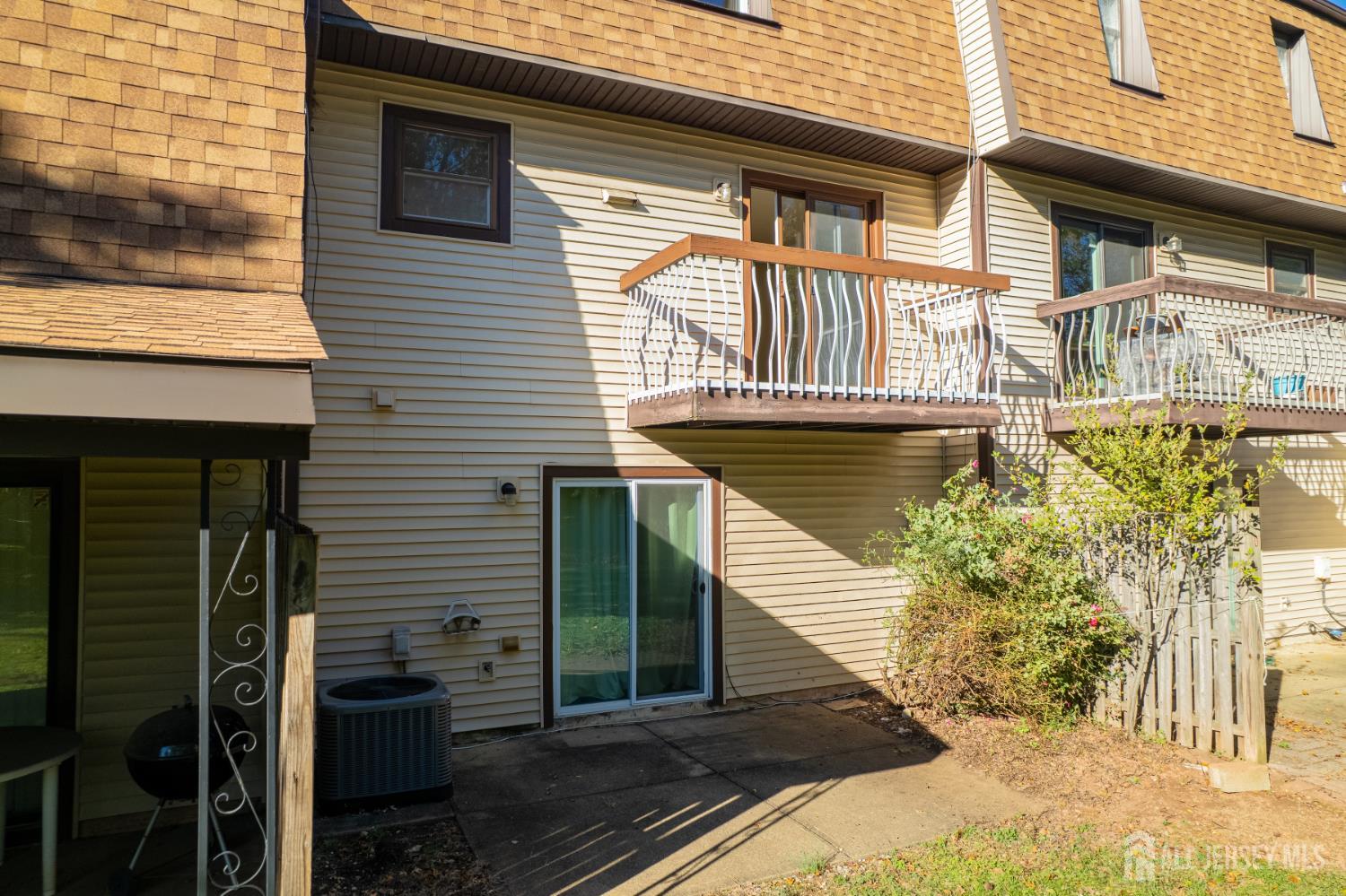 6304 Hana Road Edison, NJ 08817 - Photo 15 of 21 a front view of a house with a garden