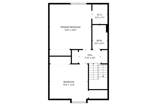 a car parked in front of a brick house