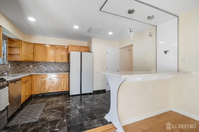 a bathroom with a tub sink and mirror