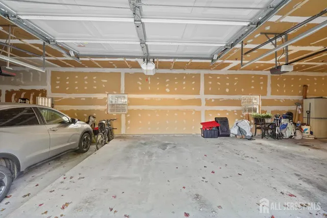 a view of a garage with parked cars