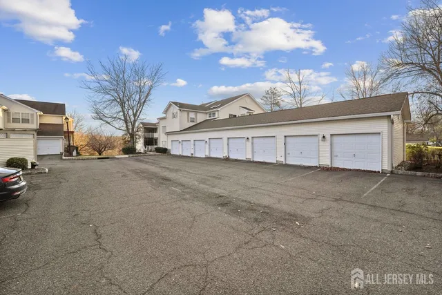 a view of a house with a yard and garage