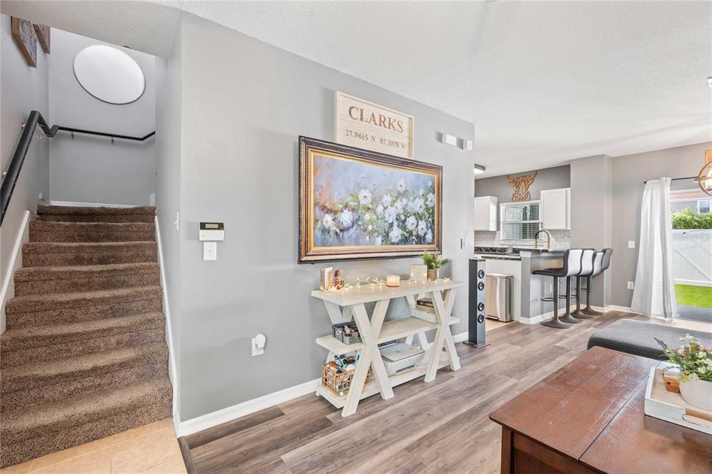 1533 Blue Magnolia Road Brandon, FL 33510 - Photo 18 of 41 a view of a living room with furniture and wooden floor
