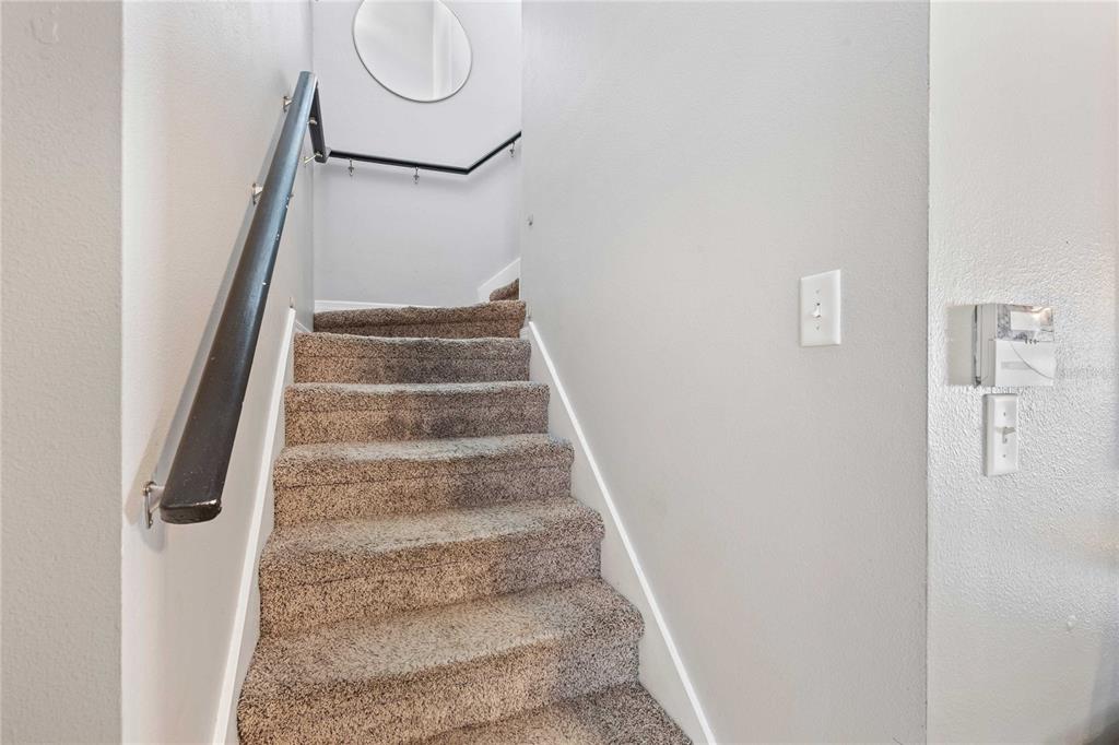 1533 Blue Magnolia Road Brandon, FL 33510 - Photo 19 of 41 a view of staircase with white walls and white door