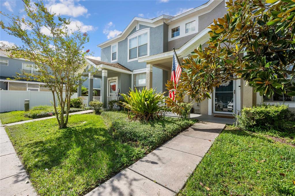 1533 Blue Magnolia Road Brandon, FL 33510 - Photo 2 of 41 a front view of a house with garden