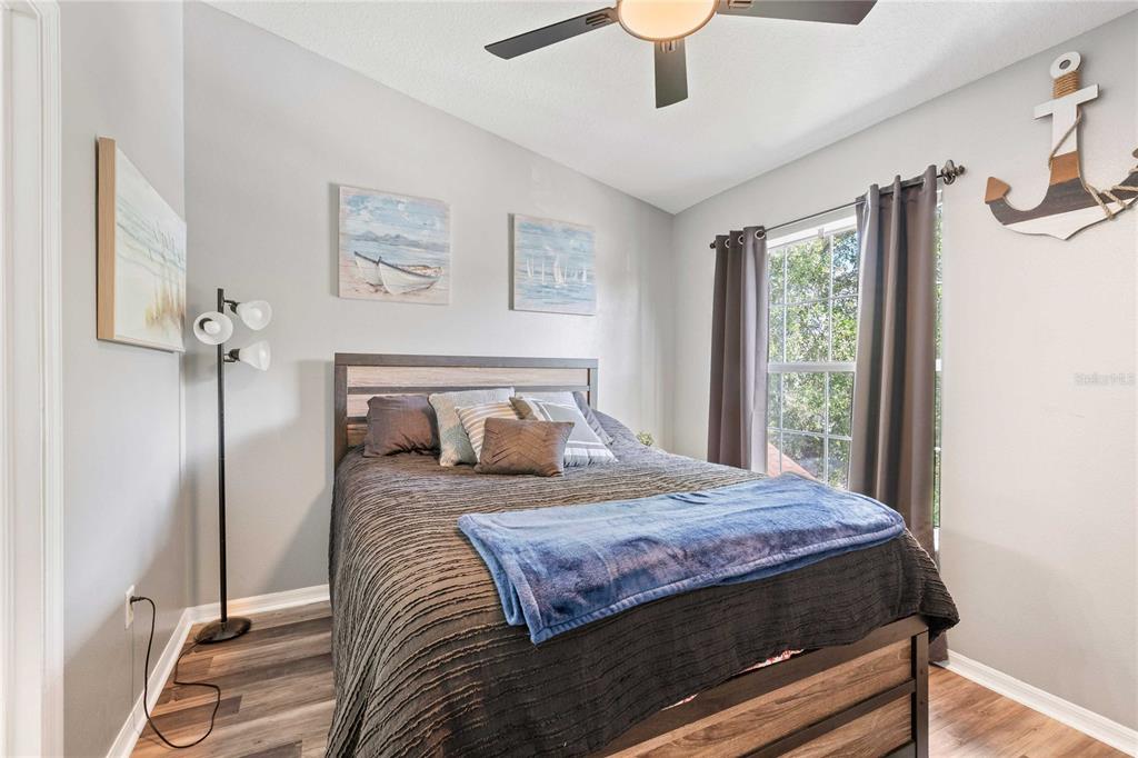 1533 Blue Magnolia Road Brandon, FL 33510 - Photo 21 of 41 a bedroom with a large bed and a window