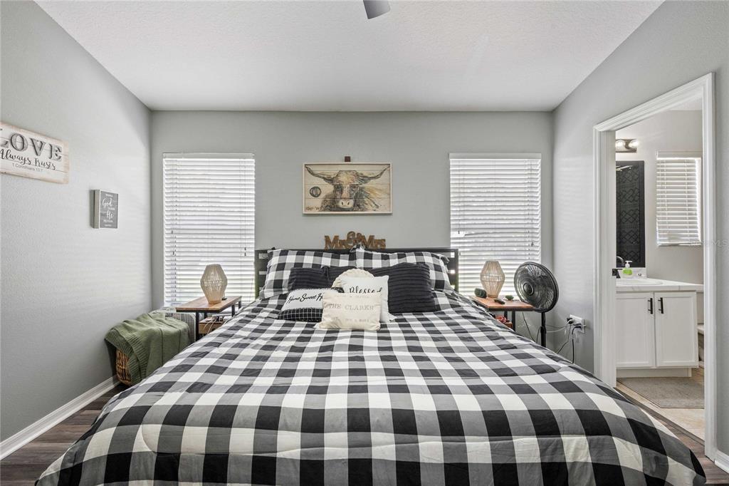 1533 Blue Magnolia Road Brandon, FL 33510 - Photo 24 of 41 a bedroom with a bed a table and chair