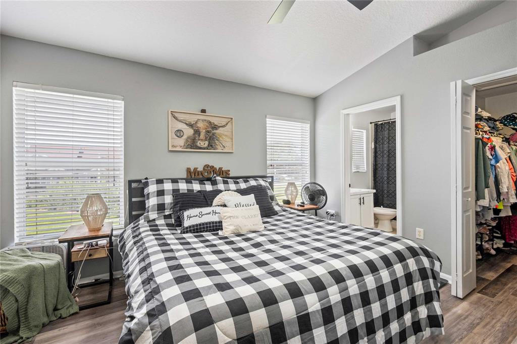 1533 Blue Magnolia Road Brandon, FL 33510 - Photo 25 of 41 a bedroom with a bed and wooden floor