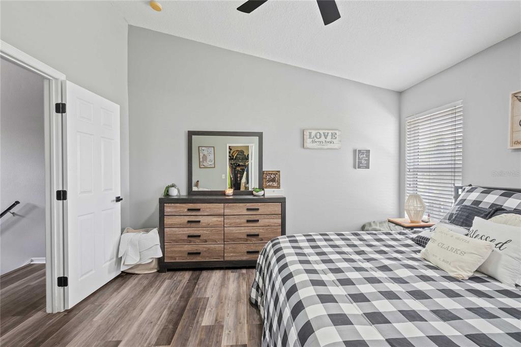 1533 Blue Magnolia Road Brandon, FL 33510 - Photo 26 of 41 a bedroom with a bed and a dresser