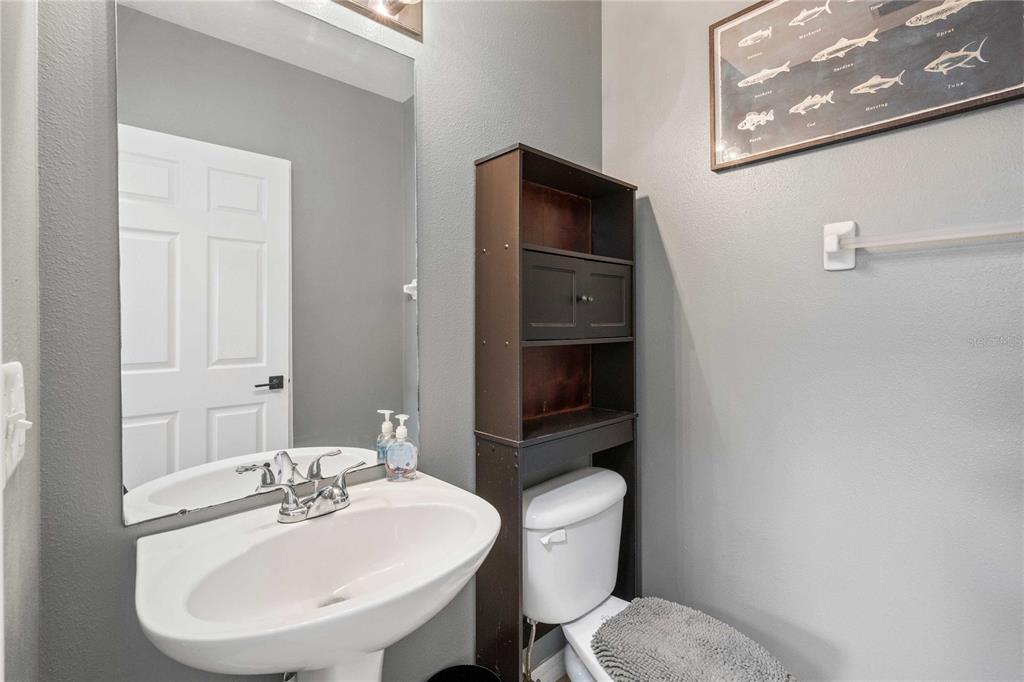 1533 Blue Magnolia Road Brandon, FL 33510 - Photo 32 of 41 a bathroom with a sink toilet and a mirror