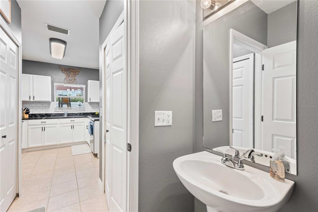 1533 Blue Magnolia Road Brandon, FL 33510 - Photo 33 of 41 a kitchen with white cabinets and white appliances