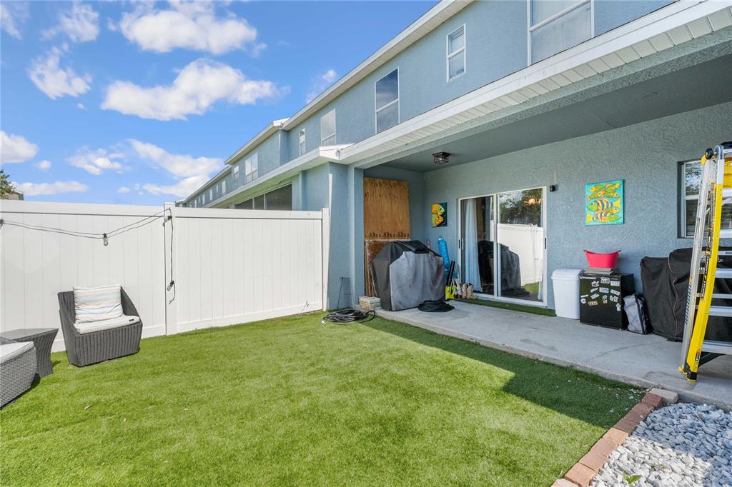 1533 Blue Magnolia Road Brandon, FL 33510 - Photo 37 of 41 a view of a chairs and table in front of a house