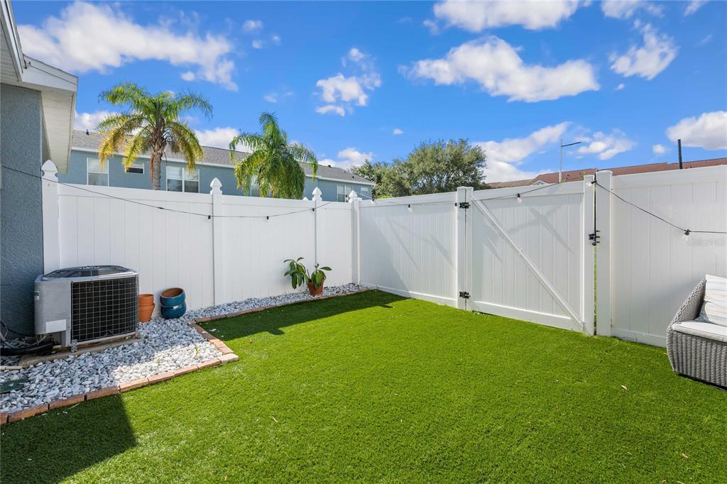 1533 Blue Magnolia Road Brandon, FL 33510 - Photo 38 of 41 a backyard of a house with table and chairs