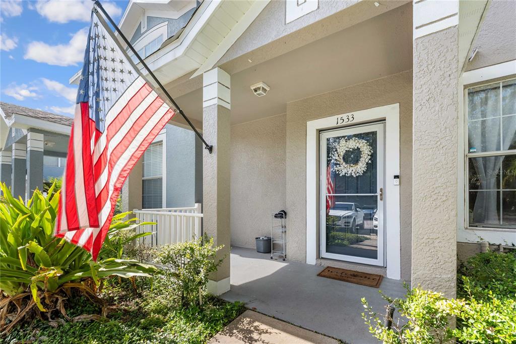 1533 Blue Magnolia Road Brandon, FL 33510 - Photo 4 of 41 a front view of a house with a yard