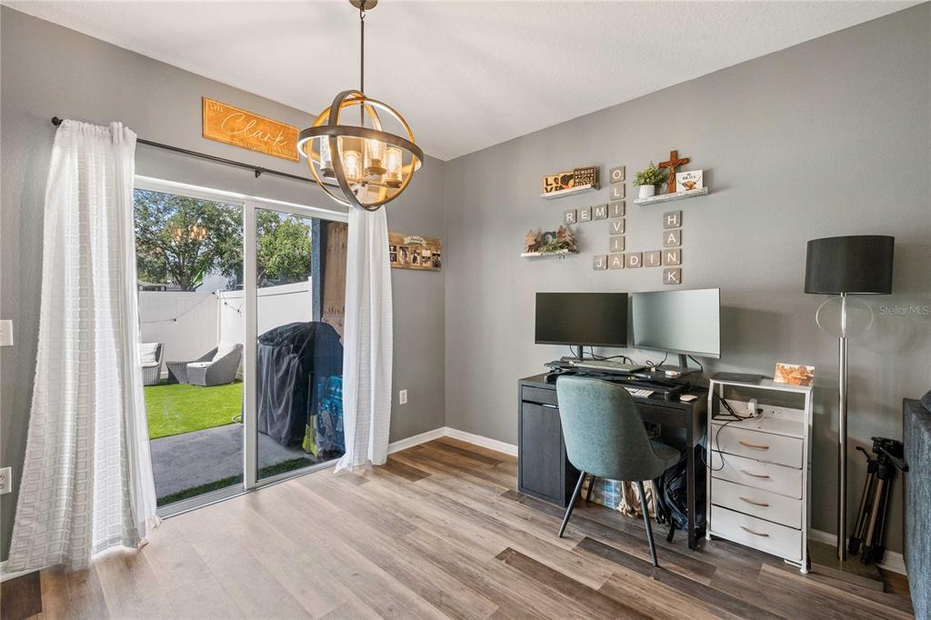 1533 Blue Magnolia Road Brandon, FL 33510 - Photo 9 of 41 a workspace with furniture window and wooden floor