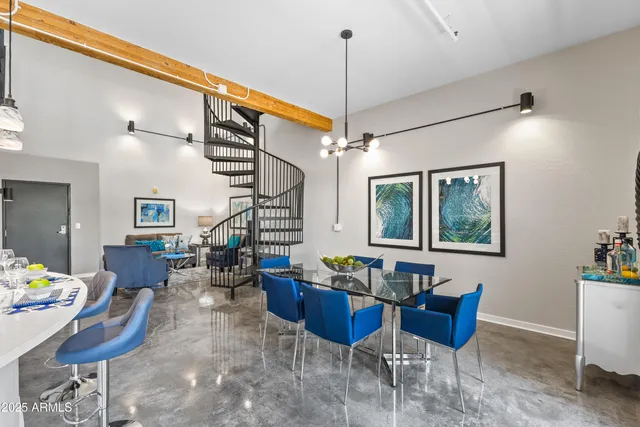 a living room with furniture a window and a chandelier