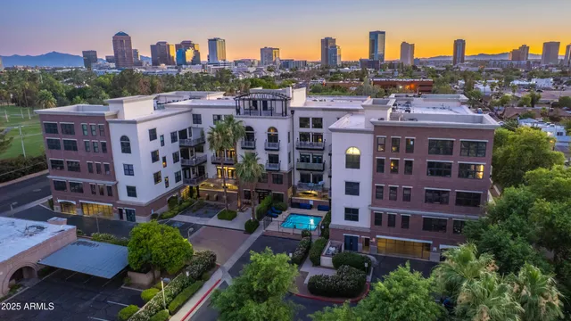 a view of a brick building next to a yard
