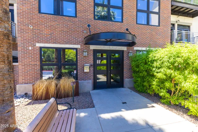 a view of a patio with table and chairs